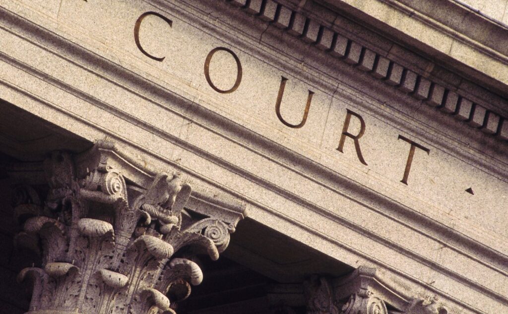 Front face of a classical-looking courthouse building.
